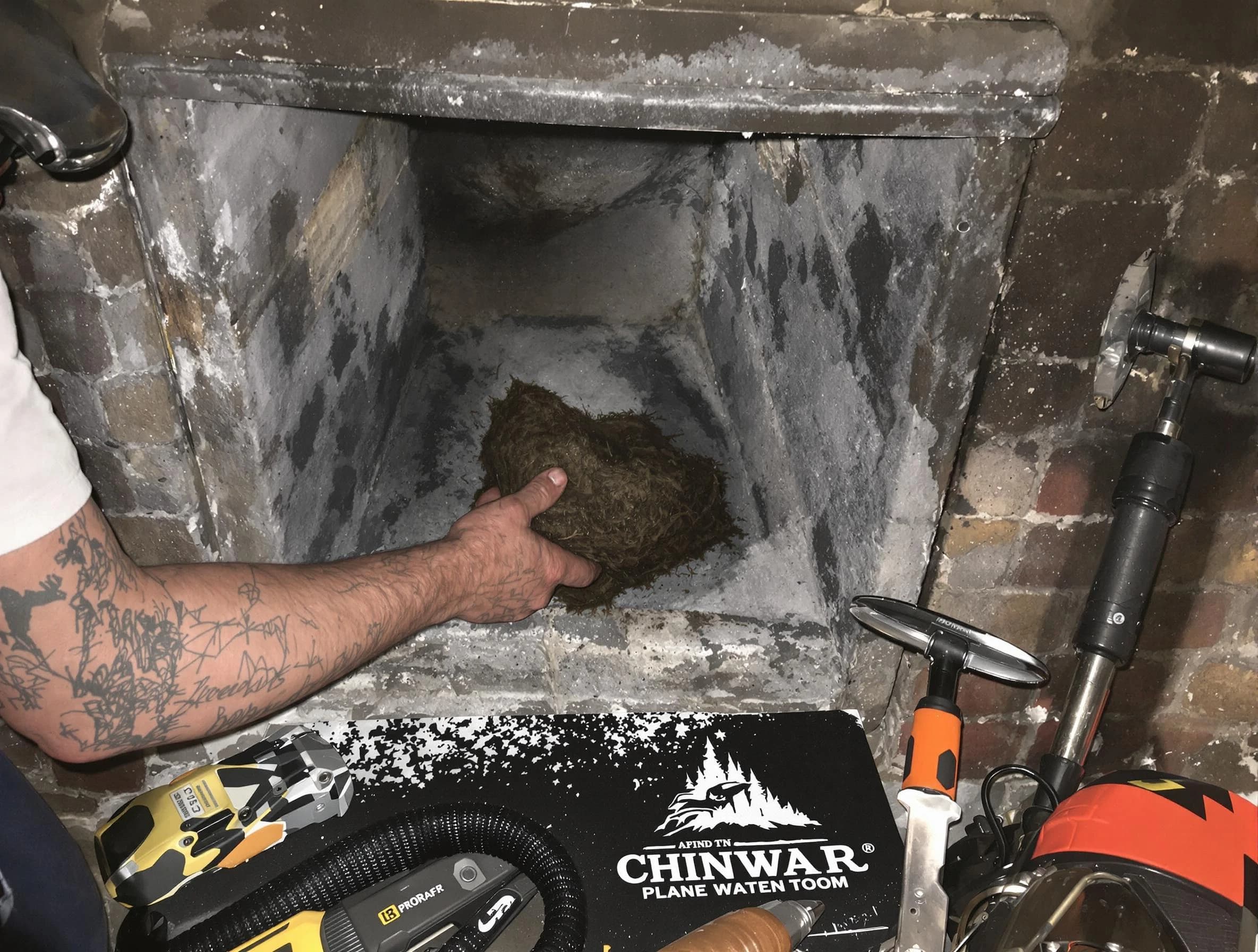 Pittsburgh Chimney Sweep safely removing debris and screening chimney in Pittsburgh, PA