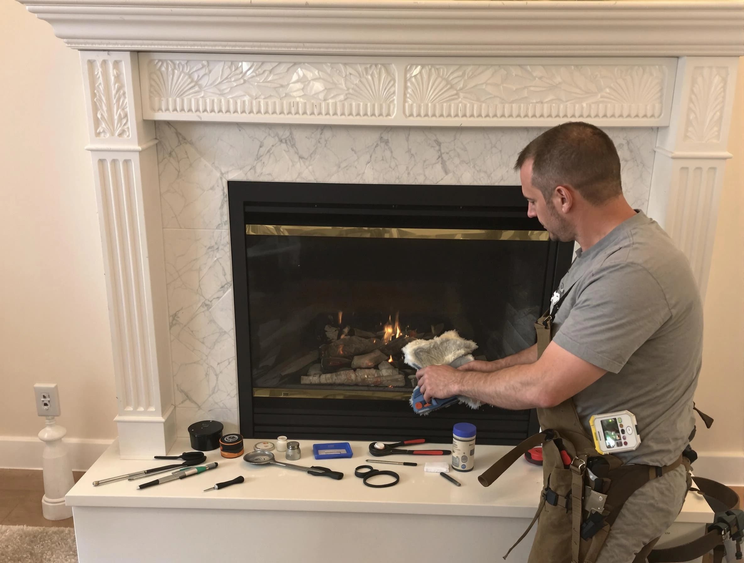 Pittsburgh Chimney Sweep performing fireplace maintenance in Pittsburgh, PA